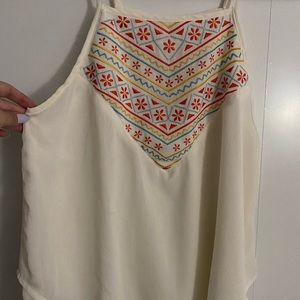 Spaghetti strap silk shirt.